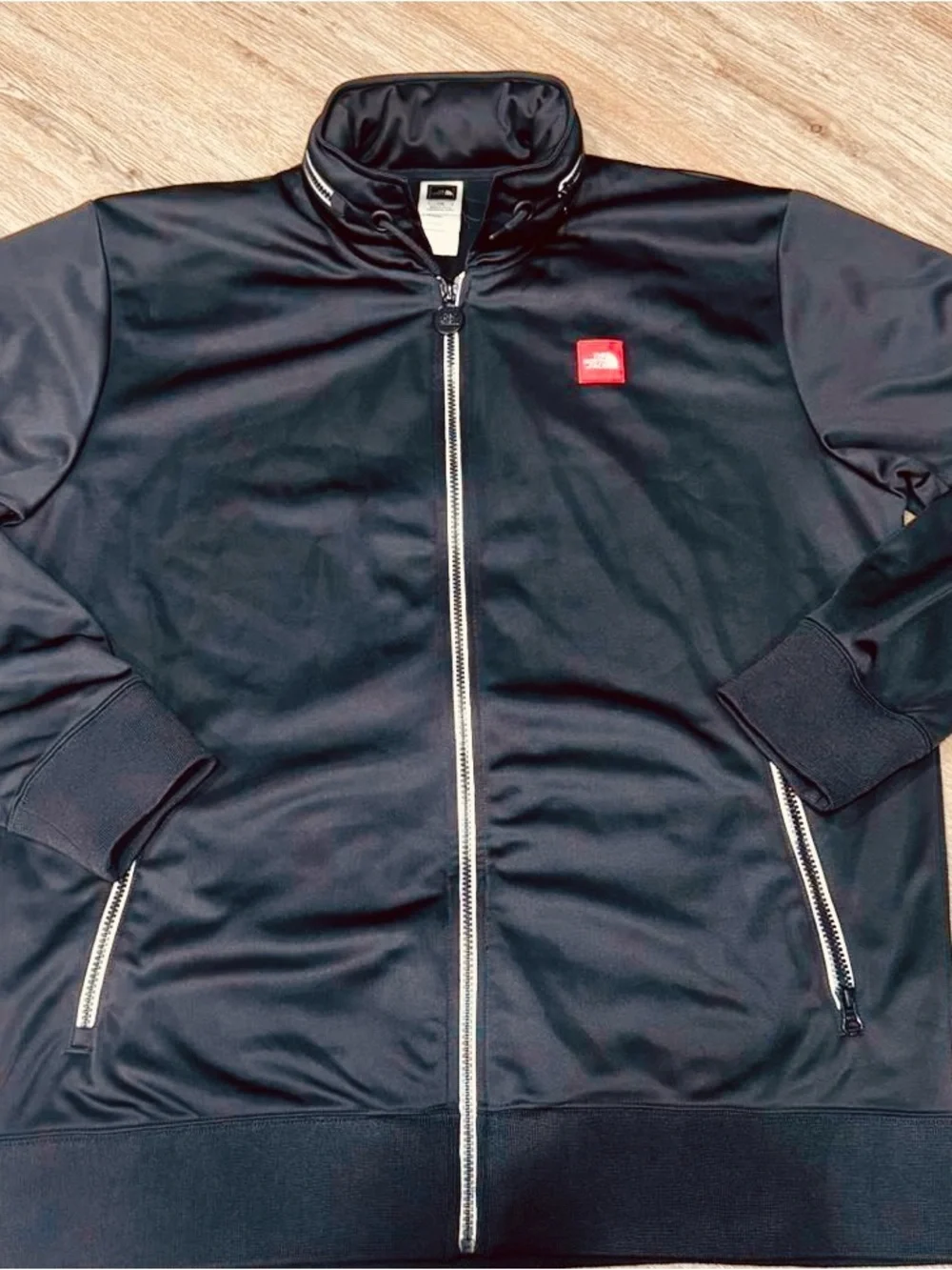 The North Face Black Jacket with Red Logo Patch